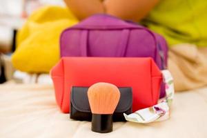 Close up makeup and cosmetic bag in bed room. photo