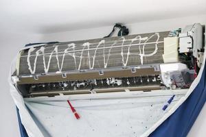 air conditioner cleaning with spray foam cleaner photo