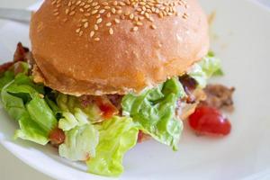 Home made beef hamburger with cheese and vegetables photo