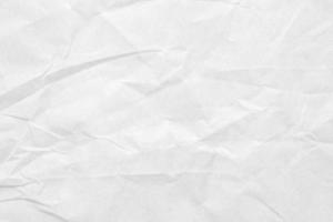 Abstract white crumpled and creased recycle paper texture background photo