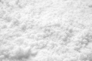 vista de ángulo alto de fondo de textura de nieve blanca foto