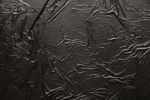 fondo de textura de bolsa de plástico arrugado y arrugado negro foto