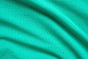 Green sports clothing fabric football shirt jersey texture background photo