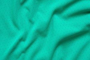 Green sports clothing fabric football shirt jersey texture background photo