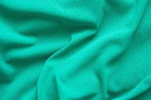 Green sports clothing fabric football shirt jersey texture background photo