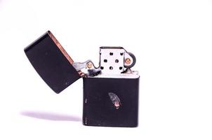 Open lighter on white background photo