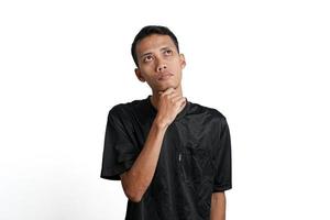 Asian man wearing black training t-shirt, Gesture thinking or getting idea. Isolated by white background photo