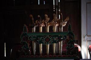 The Javanese keris that is being displayed is a traditional weapon photo