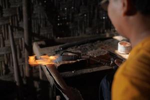The process of making keris is done manually and traditionally photo