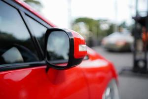 close up of modern red car mirror photo