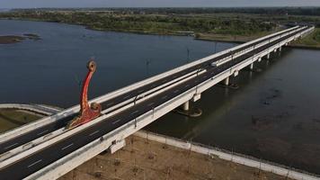 Aerial view of the Kretek 2 bridge which is the southern causeway bridge. Close to Depok beach, Bantul, Indonesia. Has a keris monument icon. photo