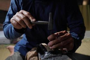 The process of making a keris is being carved to make traditional ornaments photo