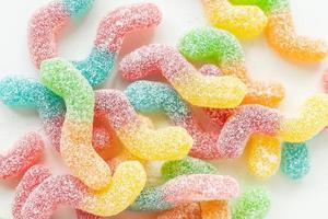 Colorful tasty jelly candies on a white background, top view. photo