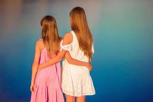 Children outdoor on edge of cliff seashore photo