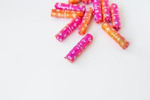 Tampons in pink and orange packaging. Hygiene and health concept. Place for an inscription. photo