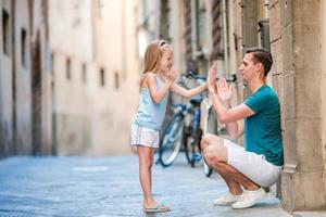 Family in Europe. Happy father and little adorable girl in Rome during summer italian vacation photo