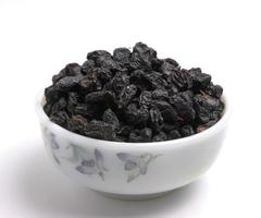 Dried raisins isolated on white background. photo