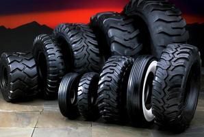 A selection of ten rubber tires on a futuristic background photo