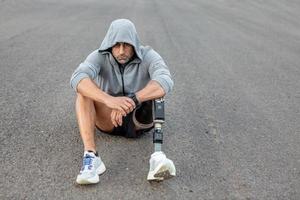 Stressed amputee during break in training photo