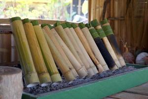 Chicken curry in a bamboo tube It is a local dish in the north of Thailand. It is a method of putting cooked food in a bamboo tube and burning it until cooked. photo