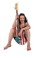 Woman with an electric guitar on a white background. photo
