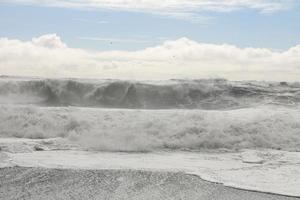 Huge white waves in cold north ocean in Iceland 7 photo