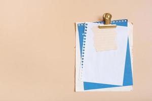 Blank sheet paper for note on colored background, desktop top view. Flat lay photo