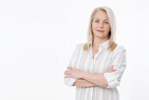 Friendly smiling middle-aged woman isolated on white background photo