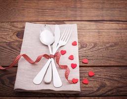 Valentines dinner on wooden background photo