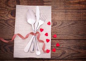 Valentines dinner on wooden background photo