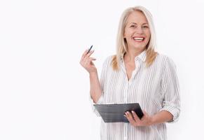 Business woman holds a pen and a folder with files isolated on white background photo