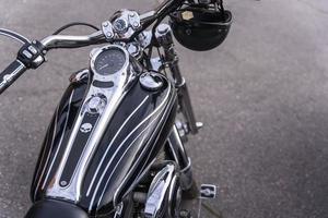 Beautiful top view of the motorcycle, motorcycle gas tank, motorcycle flatbar, shiny chrome, gas handle. photo