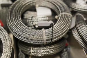 a coil of steel cable on the counter of a construction store photo