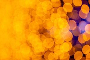 Abstract circular bokeh background of Christmaslight. bokeh from garlands. background for screensaver. Defocused lights. Blurred bokeh with yellow color lights. photo