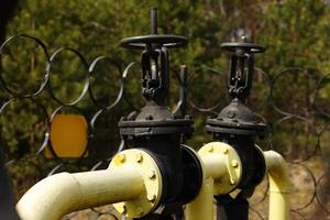 Yellow gas pipes and valves outdoors. gas equipment. Copy space for text. High quality photo