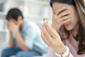 Divorce. Woman remove married ring. Couples desperate and disappointed after marriage. Husband wife sad, upset and frustrated after quarrels conflict. distrust, love problems, betrayals, family, lover