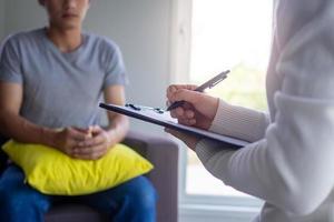 male patients with mental illnesses and physical illnesses are currently discuss with a doctor or psychiatrist. Therapy for mental symptoms and depression photo