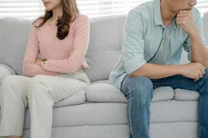 Divorce. Asian couples are desperate and disappointed after marriage. Husband and wife are sad, upset and frustrated after quarrels. distrust, love problems, betrayals. family problem, teenage love photo