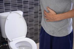 Men have contraction and stomach pain. diarrhea concept photo