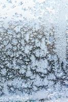 blue frost on surface on home window glass photo