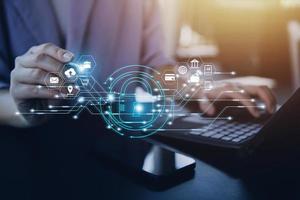 Cybersecurity and privacy concepts to protect data. Lock icon and internet network security technology. Businessman protecting personal data on smart phone with virtual screen interfaces. photo