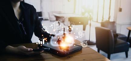 man use Laptop with cloud computing diagram show on hand. Cloud technology. Data storage. Networking and internet service concept. photo