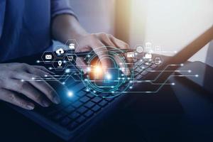 Cybersecurity and privacy concepts to protect data. Lock icon and internet network security technology. Businessman protecting personal data on smart phone with virtual screen interfaces. photo