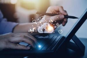 man use Laptop with cloud computing diagram show on hand. Cloud technology. Data storage. Networking and internet service concept. photo