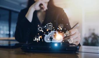 man use Laptop with cloud computing diagram show on hand. Cloud technology. Data storage. Networking and internet service concept. photo