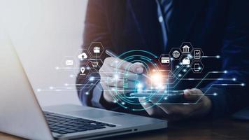 Cybersecurity and privacy concepts to protect data. Lock icon and internet network security technology. Businessman protecting personal data on smart phone with virtual screen interfaces. photo