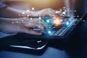 Cybersecurity and privacy concepts to protect data. Lock icon and internet network security technology. Businessman protecting personal data on smart phone with virtual screen interfaces. photo