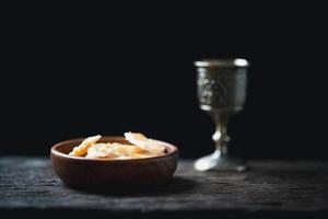 Concept of Eucharist or holy communion of Christianity. Eucharist is sacrament instituted by Jesus. during last supper with disciples. Bread and wine is body and blood of Jesus Christ of Christians. photo