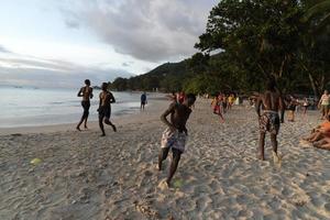 MAHE, SEYCHELLES - AUGUST 13 2019 - Local soccer team training on the beach photo