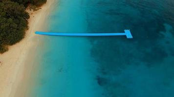 aerial view of floating pier in tropical island video